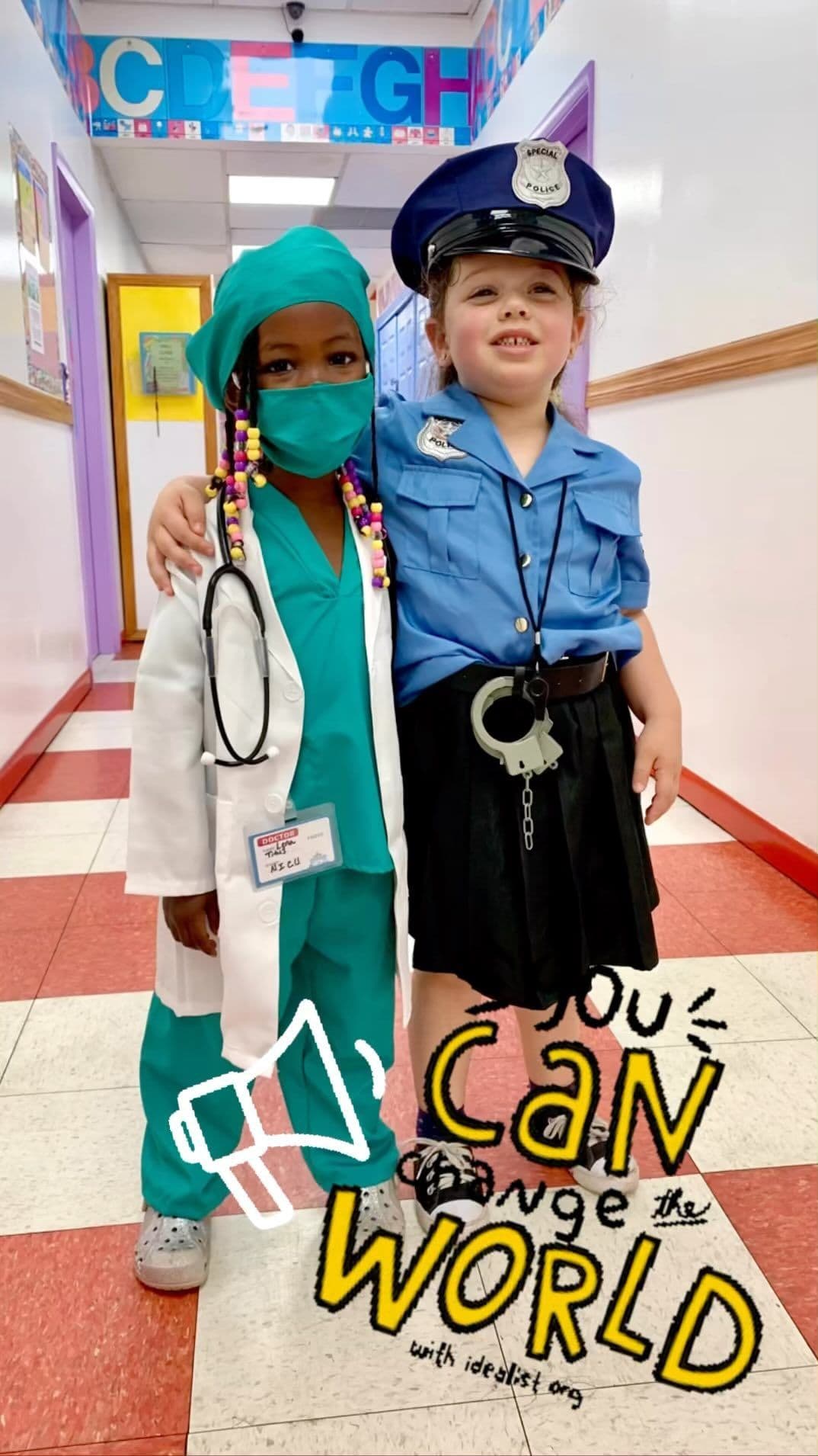 Two students dressed for Career Day as a doctor and a police officer in the school hallway.